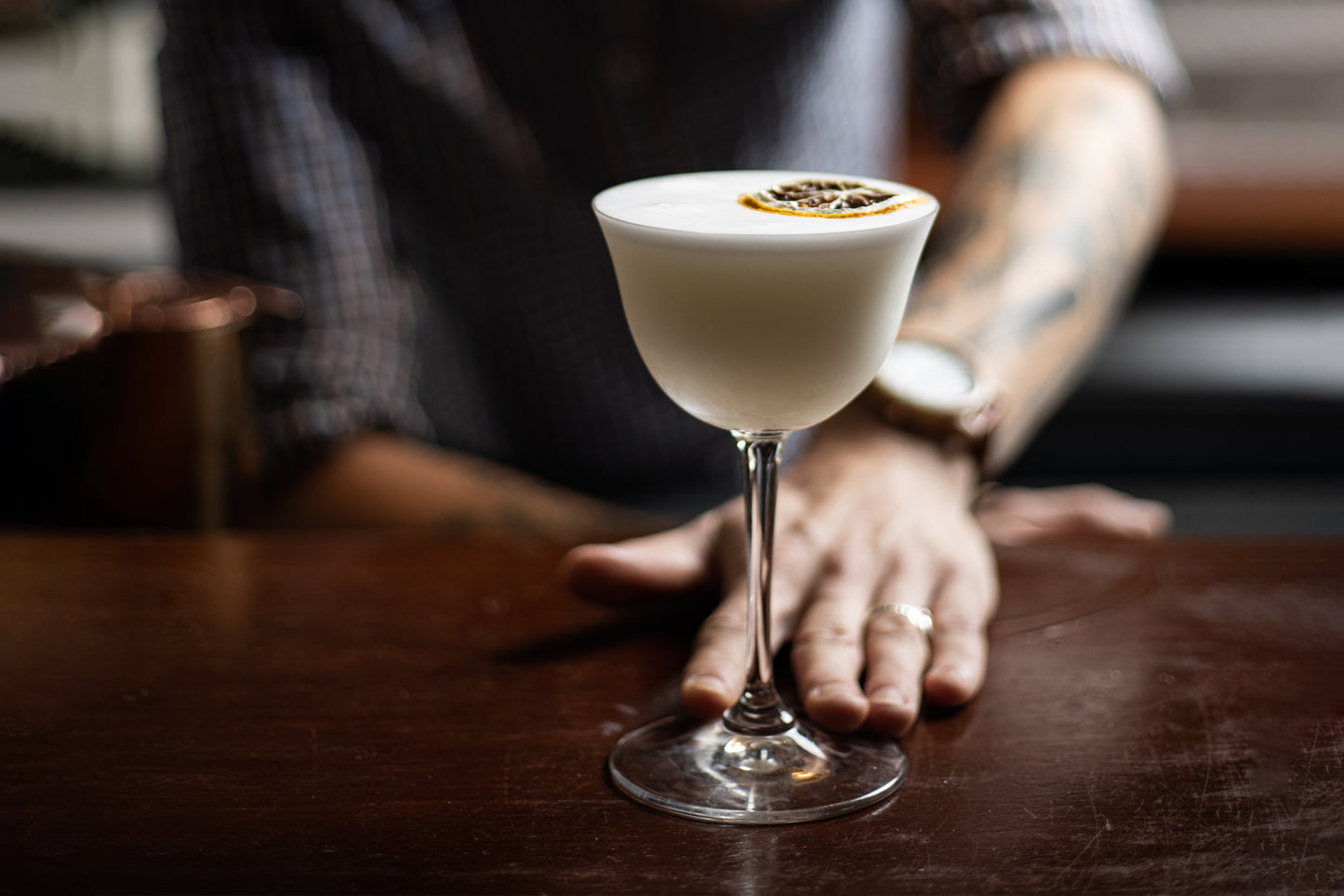 Cocktail being presented by bar tender