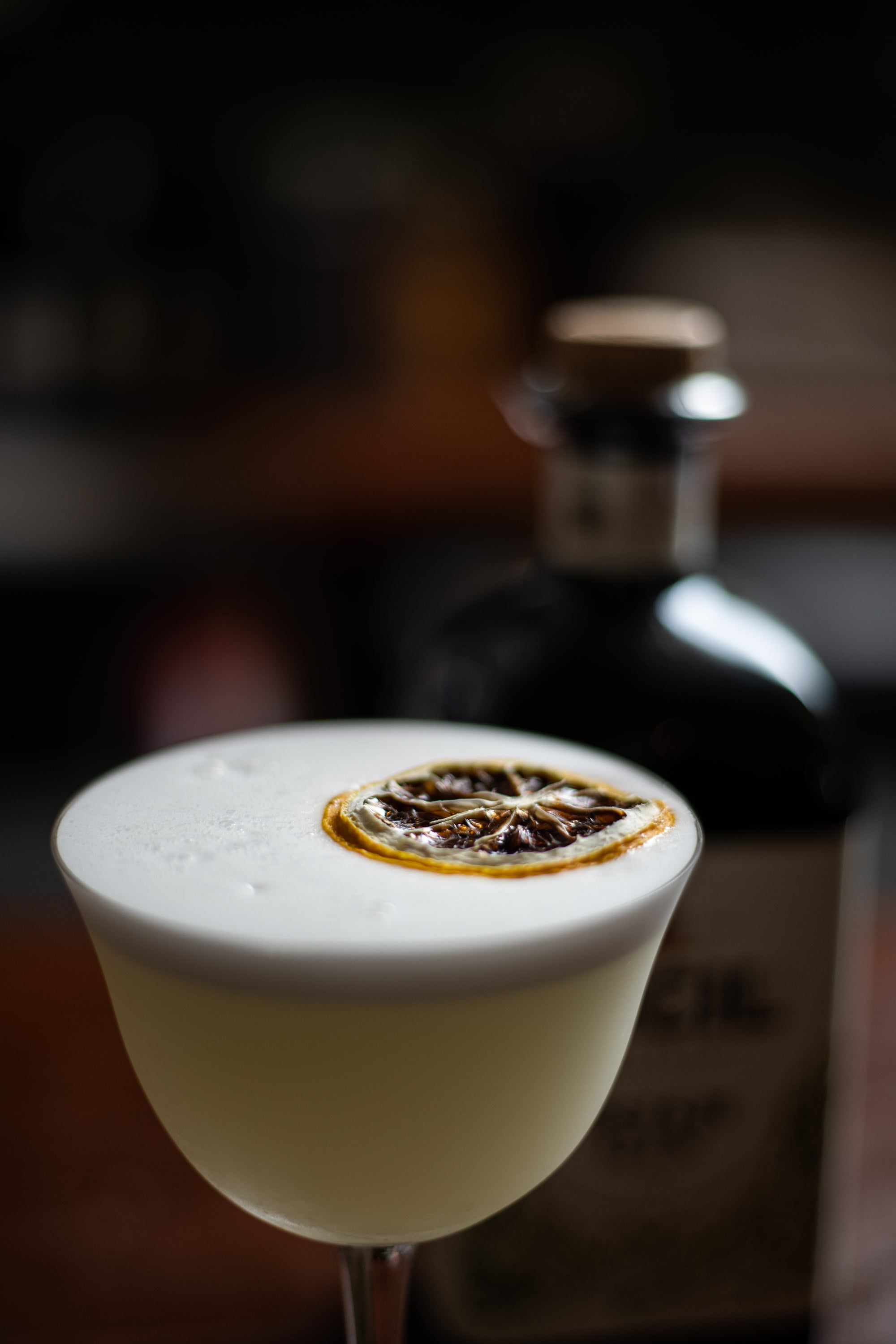 Cocktail with a dehydrated garnish on top