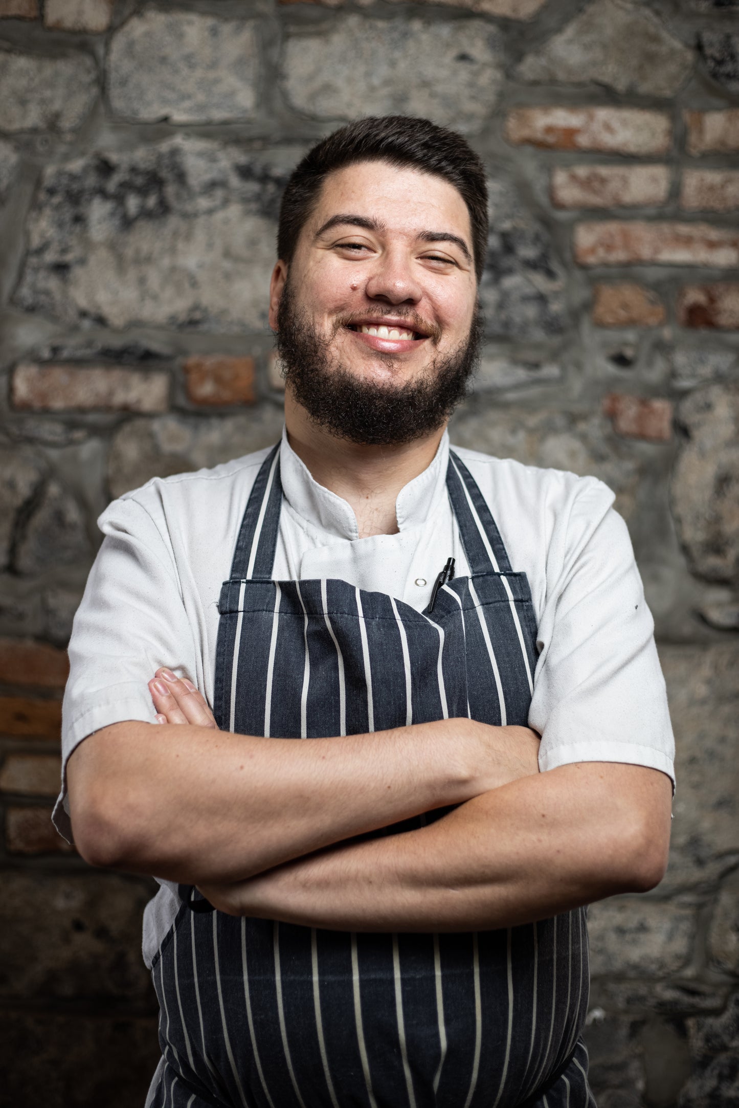Ruibin restaurant's sous chef smiling for a picture