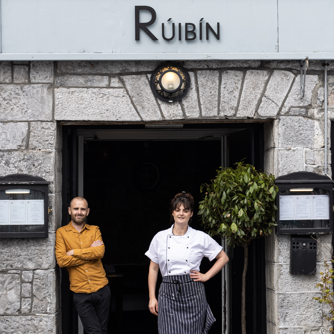 The owners of Ruibin restaurant in Galway stand outside their Restaurant