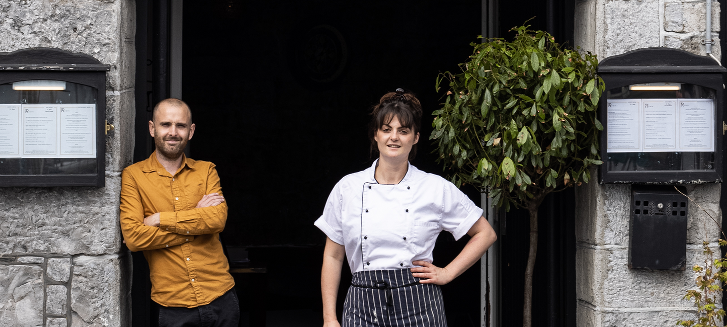 Owners of Ruibin restaurant in Galway standing outside their restaurant