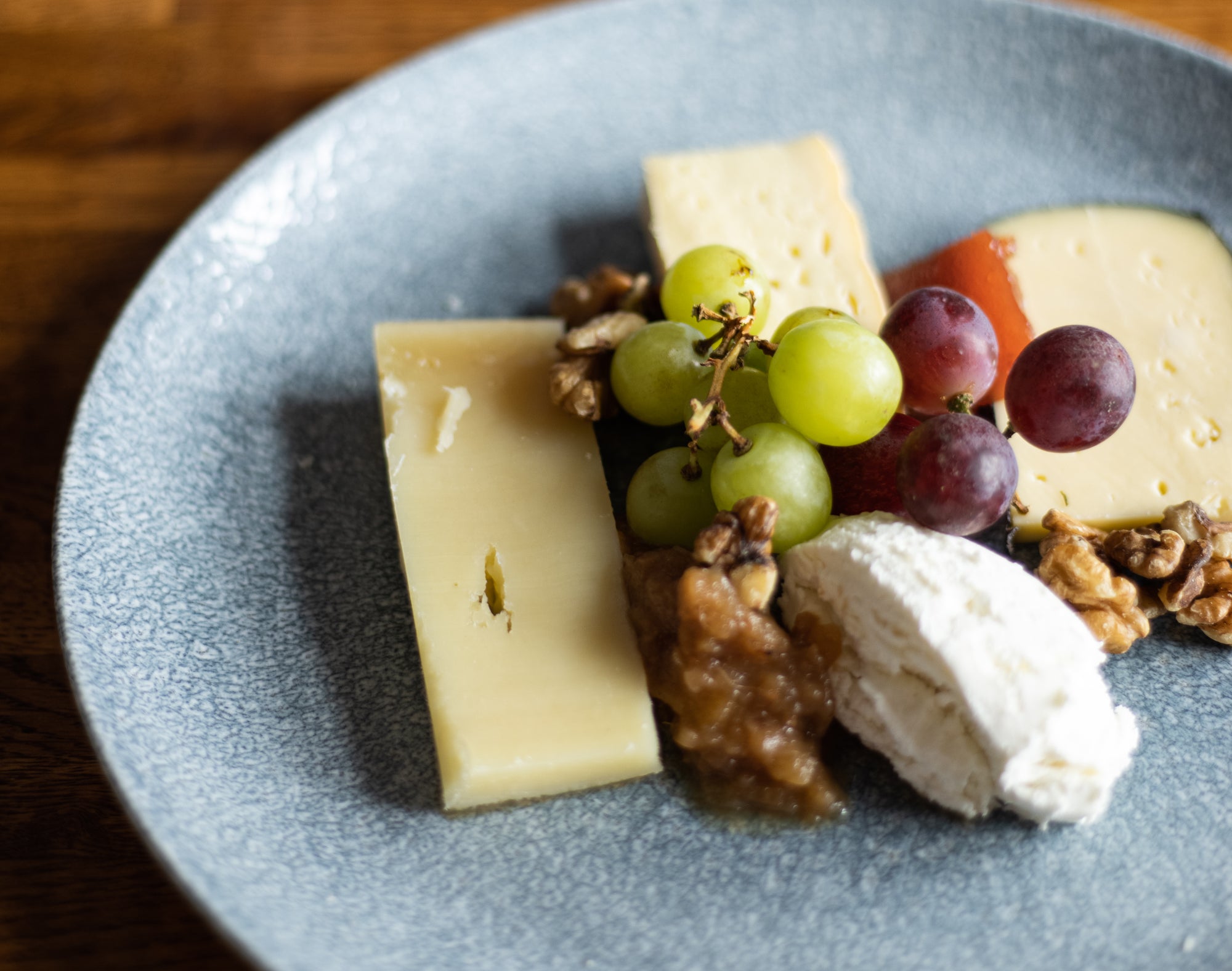 Selection of cheeses and wine on a plate